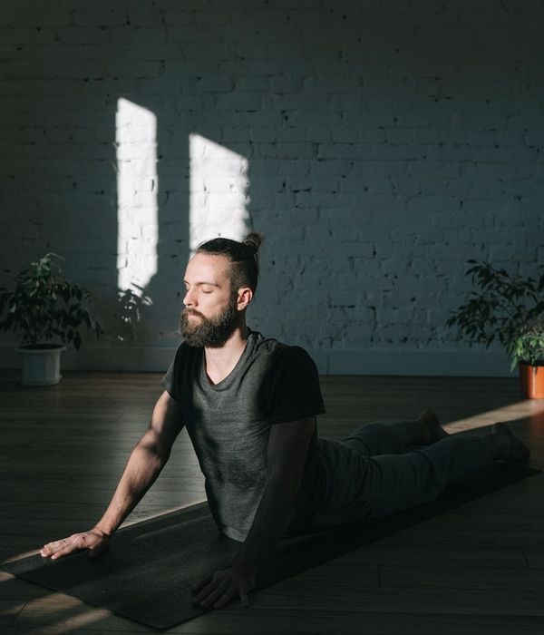 Man in a state of focused calm during a workout session.